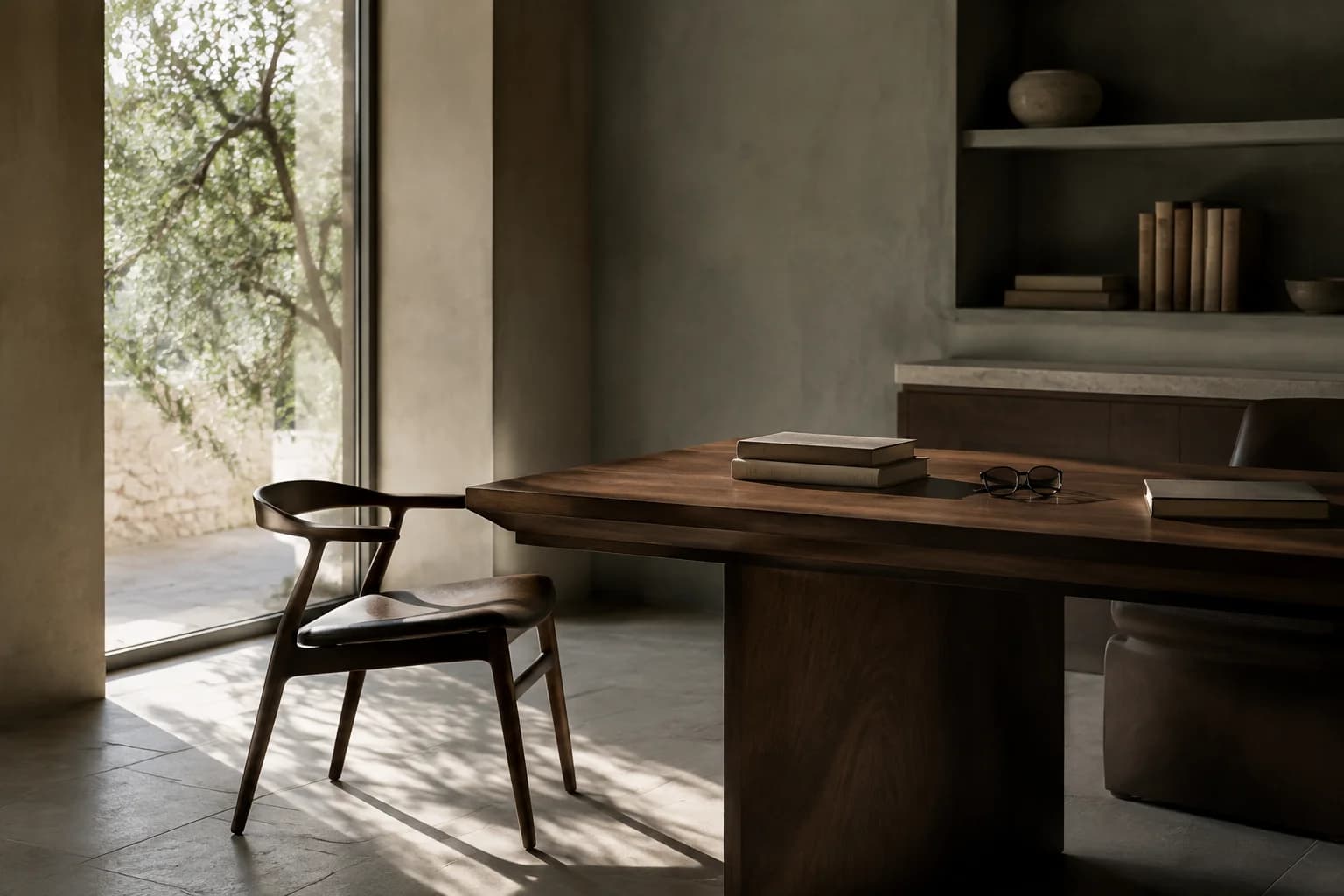 A calm, light-filled legal office with books and a meeting table